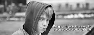 A young boy in a hoodie looks at the camera. Text reads: "Bringing Hope & Advocacy to Juveniles Accused of a Crime. Detroit Juvenile Crimes Lawyer.